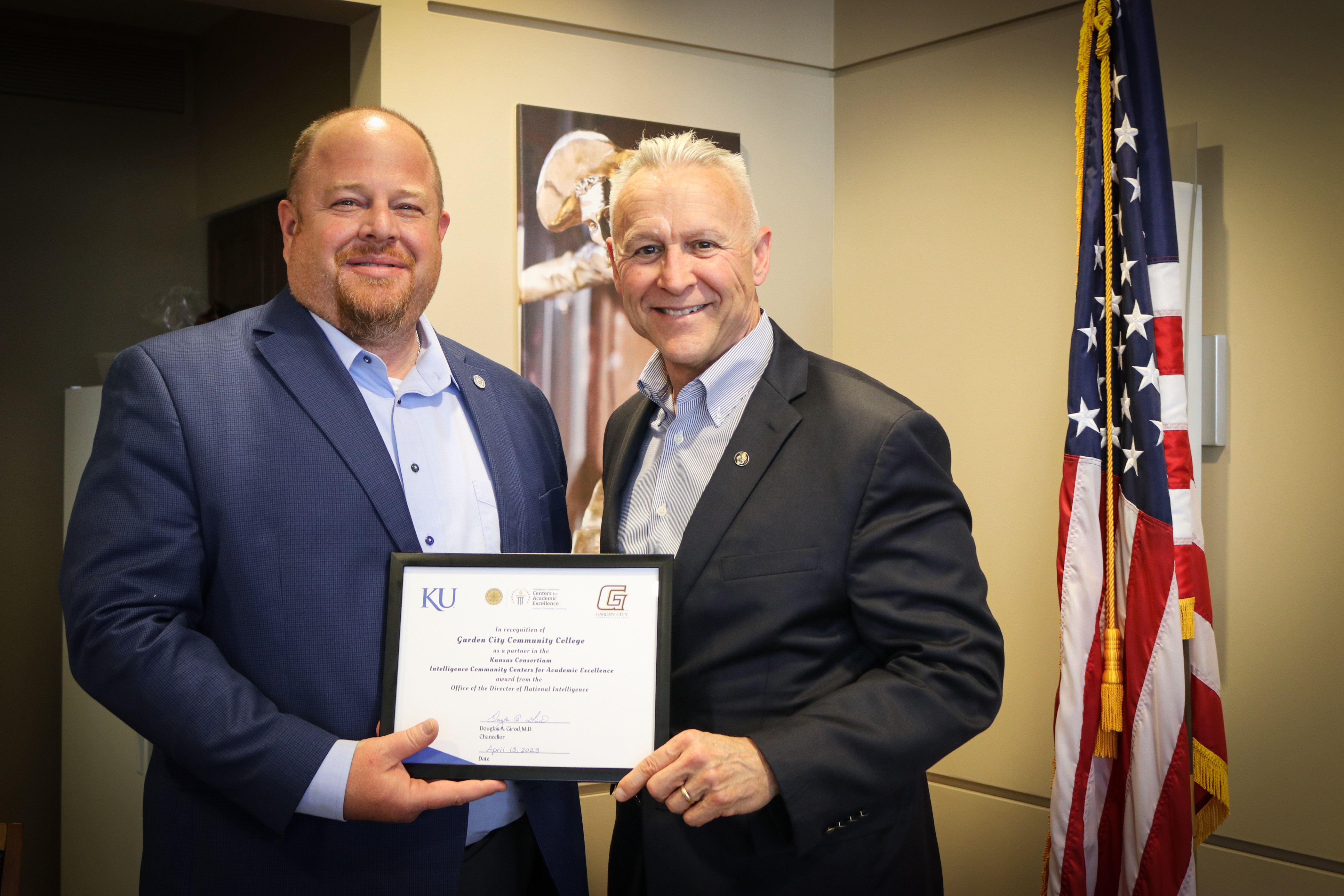   GCCC & KU IC CAE Grant, pictured left to right: Dr. Ryan Ruda, President, Garden City Community College; Mike Denning, Director of the Office of Graduate Military Programs, University of Kansas. 