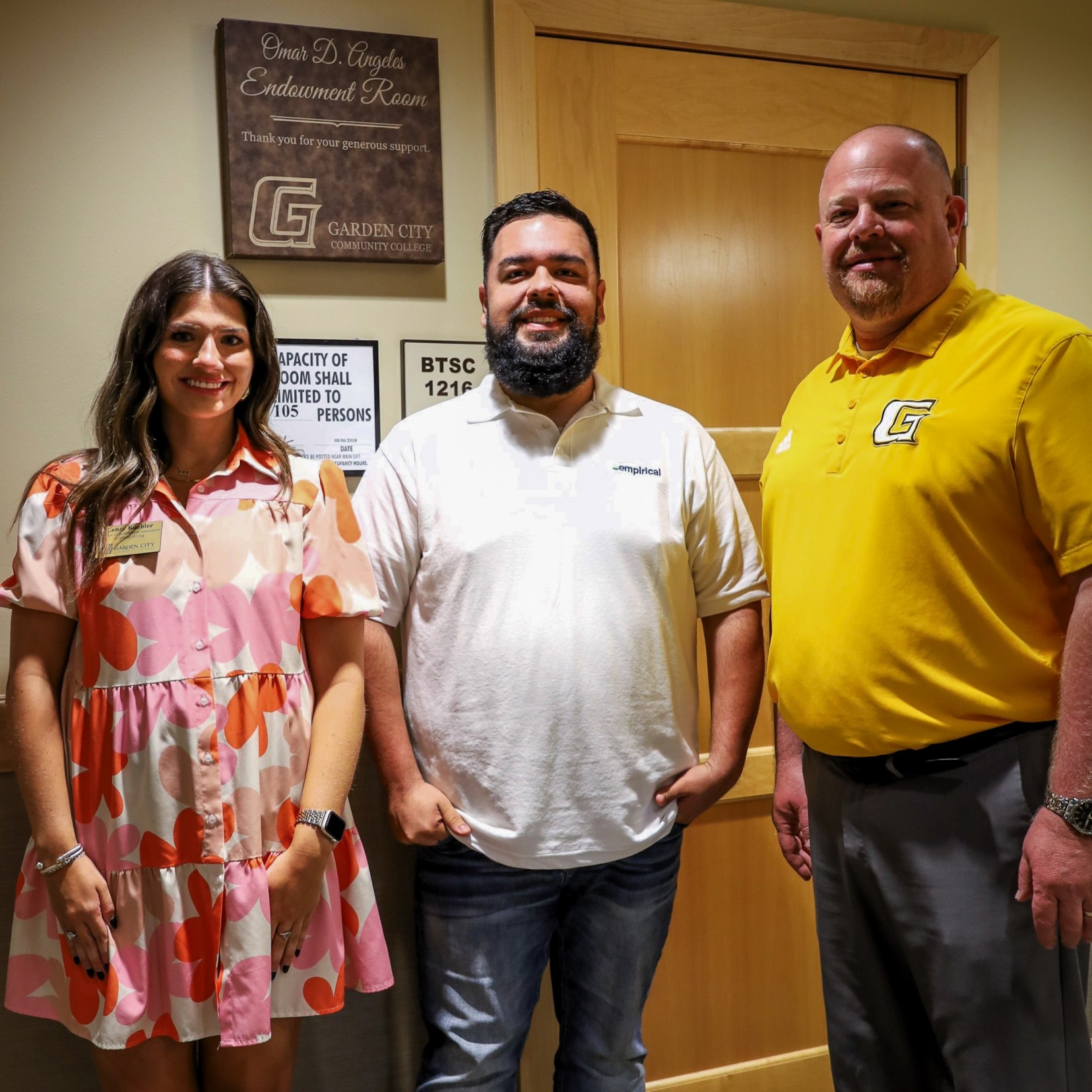 from left: Lenzy Kuebler, Omar Angeles, and Dr. Ryan Ruda with the plaque signifying the Omar D. Angeles Endowment Room on July 12, 2024.
