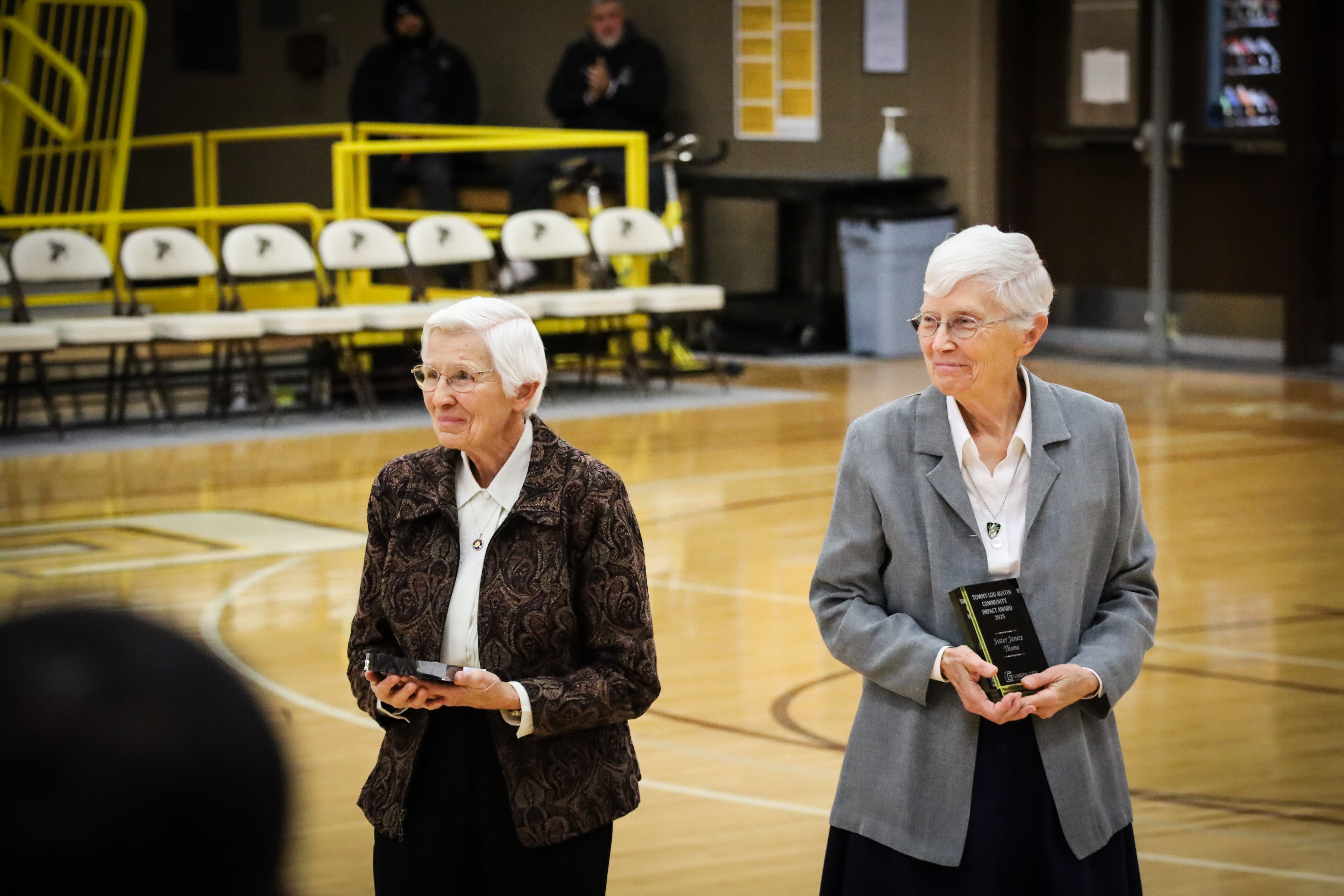 Sister Roserita Weber (left) and Sister Janice Thome receive the 2025 Tommy Austin Community Impact Award on January 20, 2025, at GCCC.