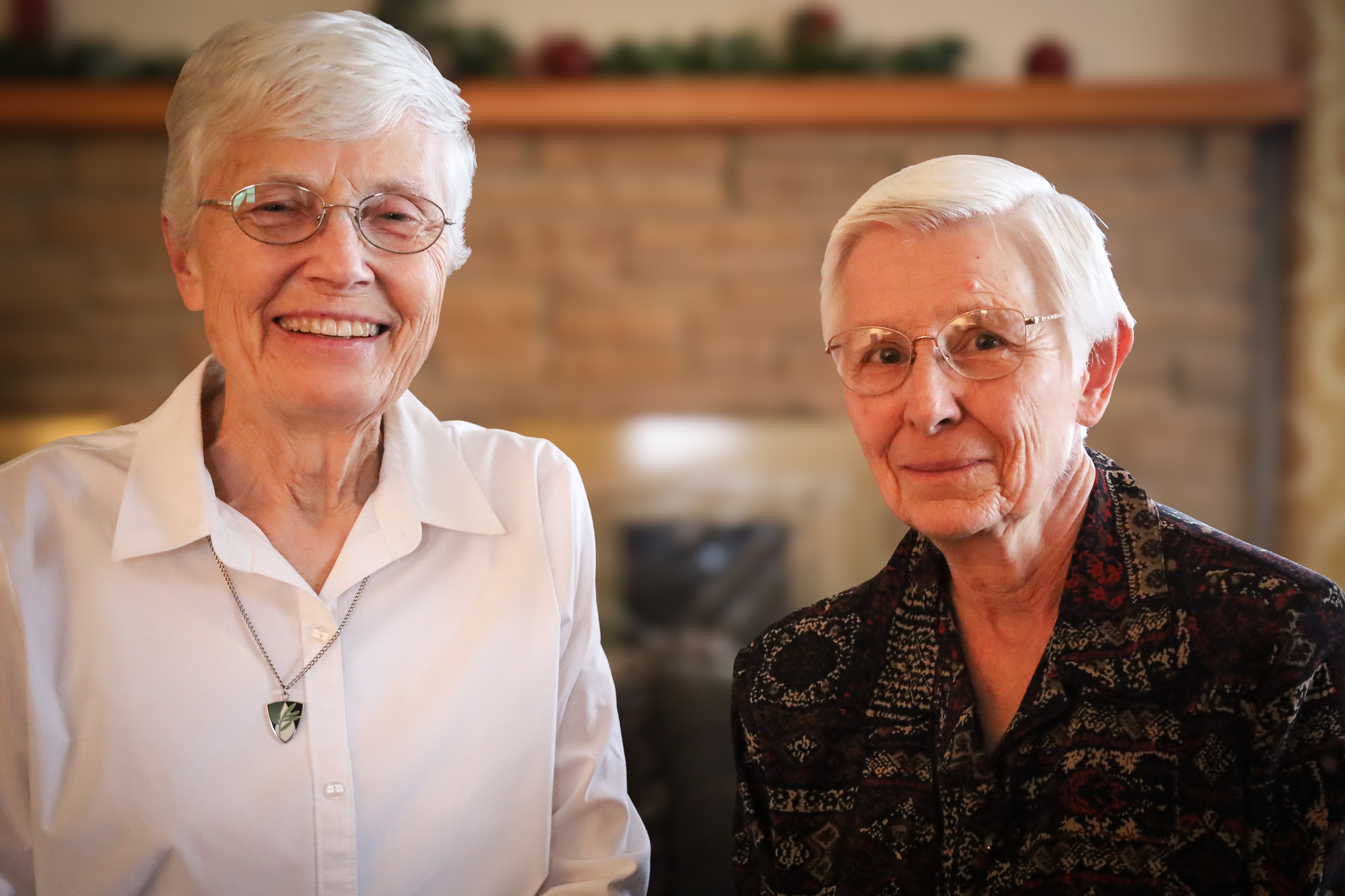 Sister Janice Thome (left) and Sister Roserita Weber (right) share a moment together.