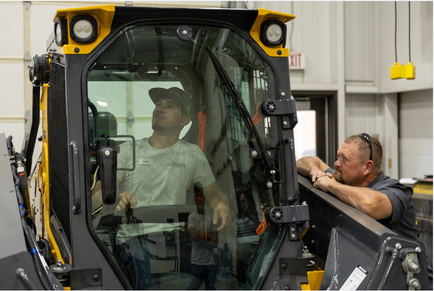 Camp student in bulldozer