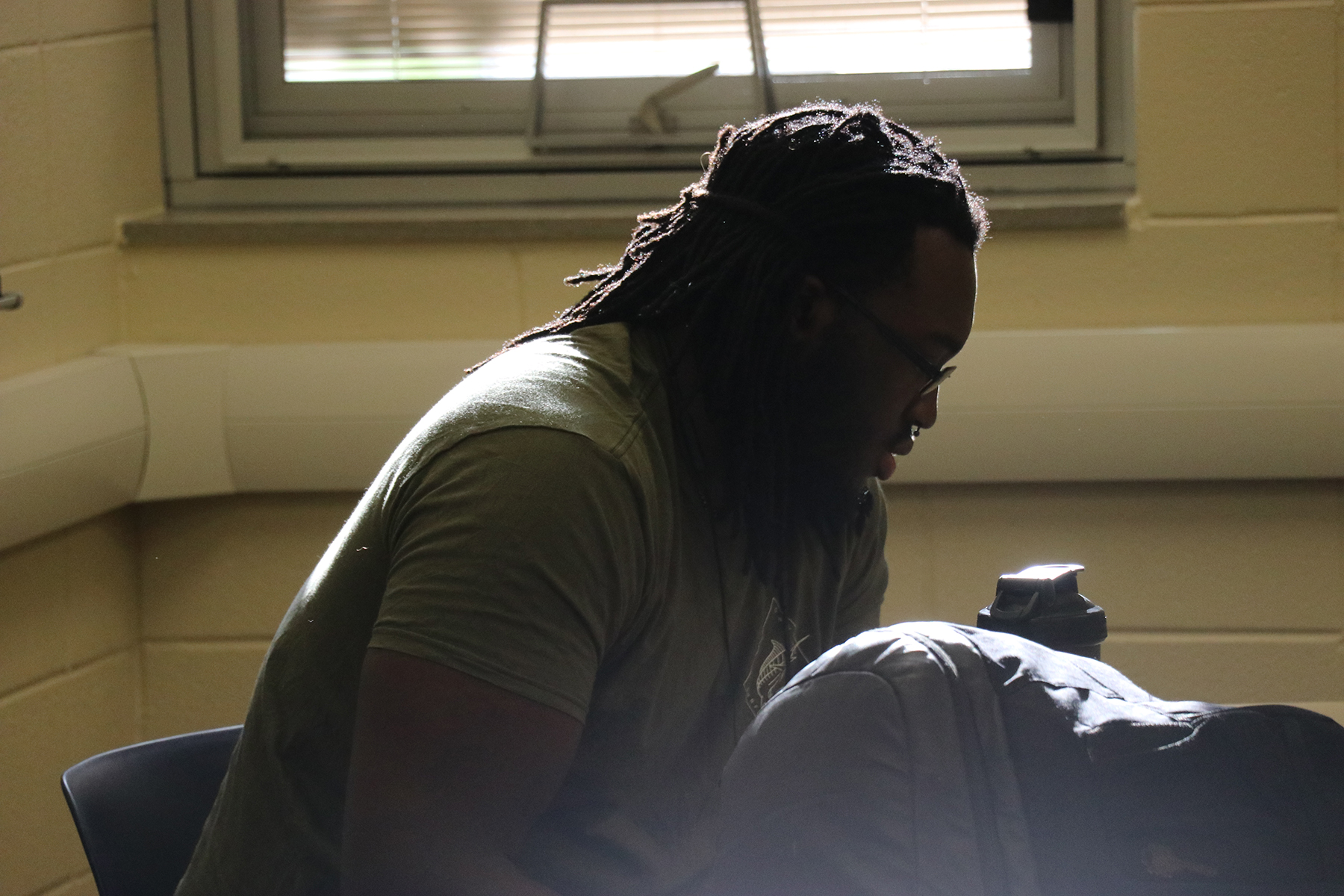 student sitting in front of window