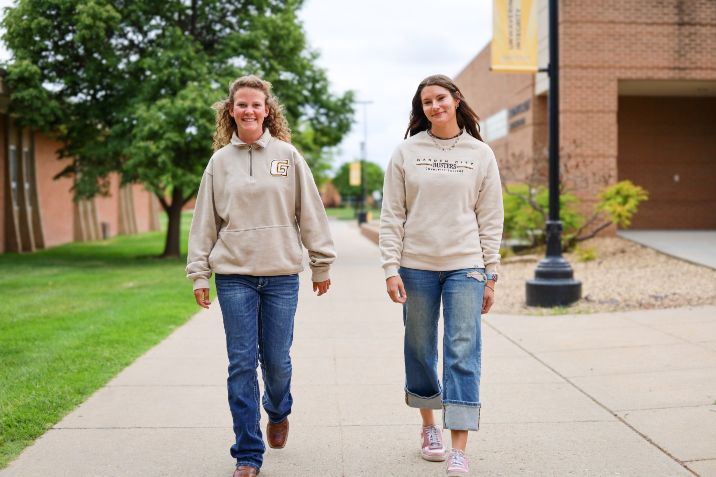 Two students walking on campus