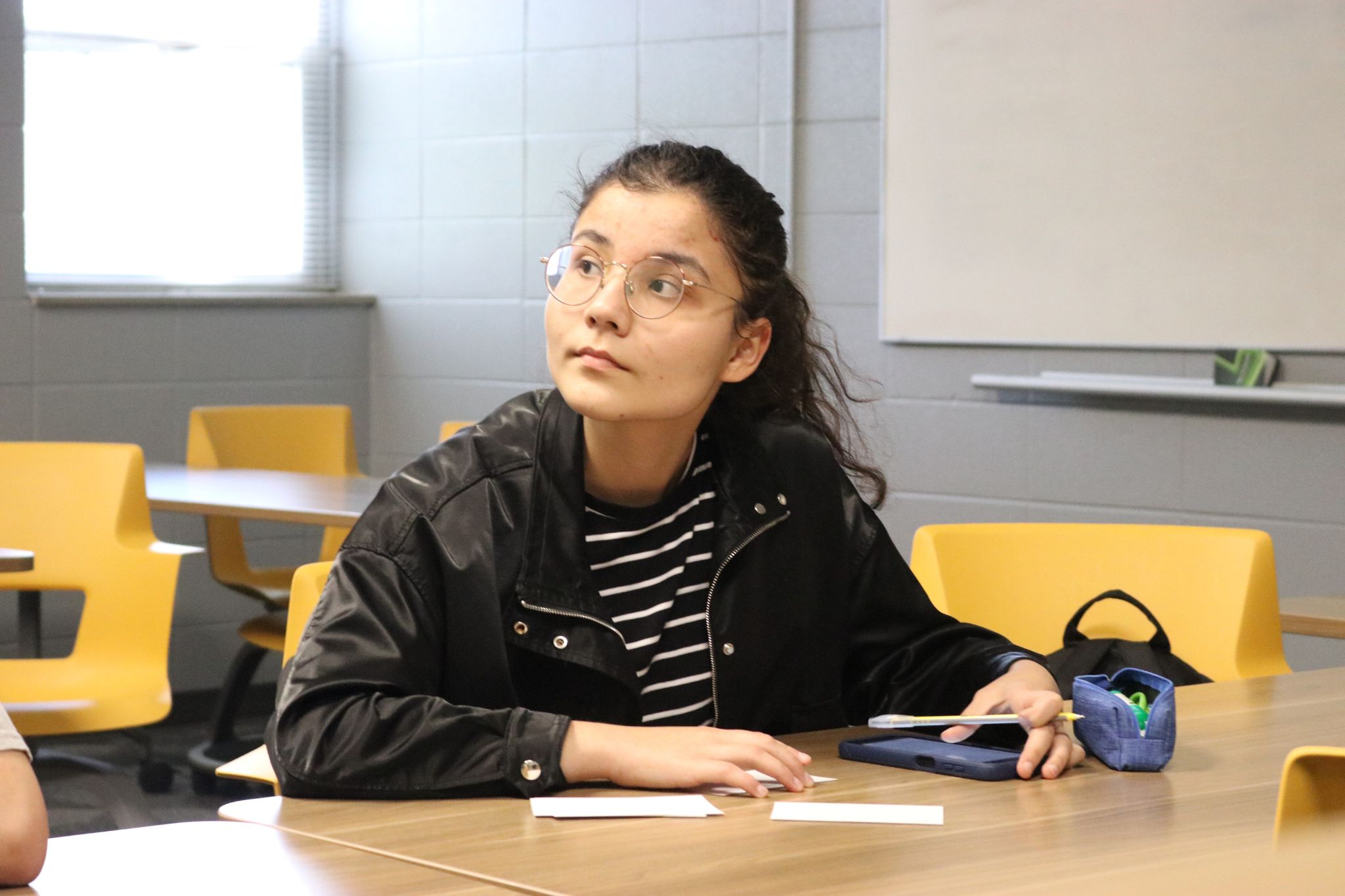 person listening to class lecture