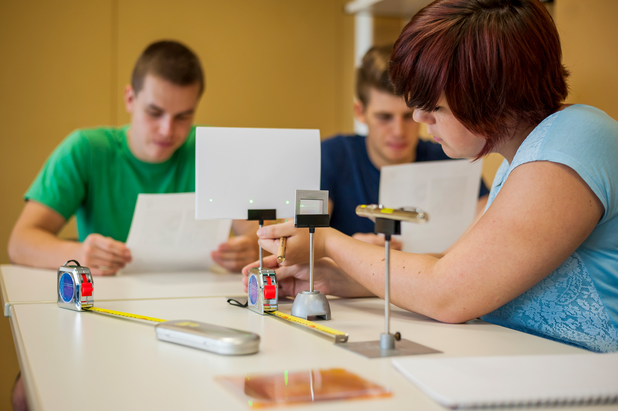 students sitting at desk participating in lab